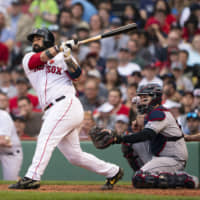 Boston's Sandy Leon smacks a three-run home run in the fifth inning against Cleveland on Monday at Fenway Park.