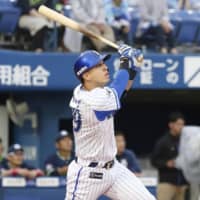 The BayStars' Neftali Soto slugs a solo homer in the first inning on Friday against the Swallows at Yokohama Stadium. Yokohama defeated Tokyo Yakult 3-2.