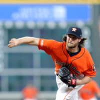 Houston starter Gerrit Cole pitches against Baltimore in the first inning on Friday night.