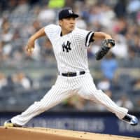 New York starter Masahiro Tanaka pitches against Tampa Bay in the first inning on Monday night.