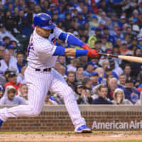 Cubs catcher Willson Contreras slugs a grand slam during the first inning against the White Sox at Wrigley Field on Wednesday. Contreras homered again in the third inning.