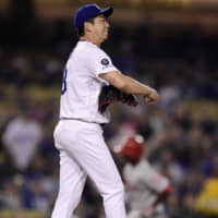 The Dodgers' Kenta Maeda stands on the pitching mound on Friday.