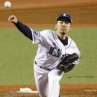 The Lions' Keisuke Honda fires a pitch in Saturday afternoon's game against the Buffaloes at MetLife Dome. Seibu blanked Orix 7-0.