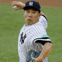 New York's Masahiro Tanaka pitches to the Red Sox on Saturday in London.