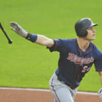Minnesota's Max Kepler watches his two-run home run against Cleveland in the third inning on Thursday night.