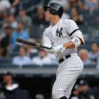 Yankees right fielder Aaron Judge follows through on a solo home run against the Blue Jays in New York on Tuesday.