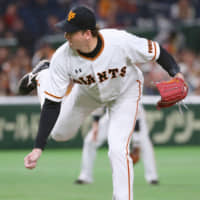 Yomiuri reliever Scott Mathieson, seen pitching in 2018, is back with the team after recovering from knee surgery.