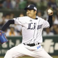 The Lions' Yasuo Sano fires a pitch in Tuesday's interleague game against the Giants at MetLife Dome. Seibu won 4-0.
