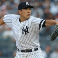Masahiro Tanaka pitches against the Astros during the Yankees' 7-5 win on Saturday at Yankee Stadium.