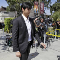 Los Angeles Angels designated hitter Shohei Ohtani arrives at a memorial service for pitcher Tyler Skaggs, who died on July 1, at the St. Monica Catholic Church on Monday in Los Angeles.