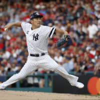 Masahiro Tanaka, of the New York Yankees, pitches during the second inning of the MLB All-Star Game on Tuesday in Cleveland.