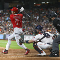The Angels' Shohei Ohtani homers during the third inning against the Astros on Sunday in Houston. The Astros won 11-10 in 10 innings.