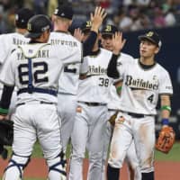 Orix players celebrate after their win over the Hawks on Sunday at Kyocera Dome.