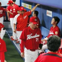 The Carp, seen in the visitors' dugout at Nagoya Dome during their contest against the Dragons on Wednesday, have lost 11 straight games.