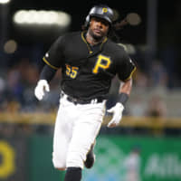 Pittsburgh's Josh Bell runs the bases after hitting a home run against Chicago in the eighth inning on Monday night.