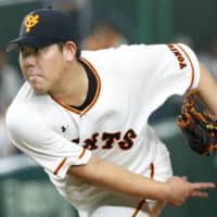 Giants starter Shun Yamaguchi fires a pitch in Friday's game against the BayStars at Tokyo Dome. Yomiuri beat Yokohama 8-4.