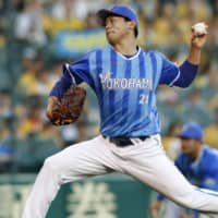 BayStars southpaw Shota Imanaga pitches against the Tigers on Thursday at Koshien Stadium. Imanaga led Yokohama to a 6-0 victory over Hanshin, going the distance in a 124-pitch effort.