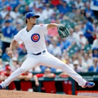 Cubs starter Yu Darvish pitches against the Reds in the first inning on Wednesday at Wrigley Field.