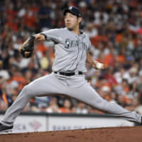 Seattle starter Yusei Kikuchi delivers a pitch against Houston in the first inning on Friday night at Minute Maid Park.