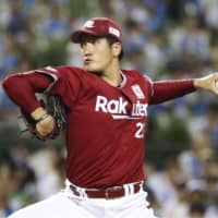Eagles lefty Hayato Yuge fire a pitch in Tuesday's game against the Lions at MetLife Dome. Tohoku Rakuten hammered Seibu 10-0.