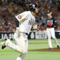 The Hawks' Yuki Yanagita rounds the bases after hitting a seventh-inning home run against the Buffaloes on Thursday at Yafuoku Dome. Fukuoka SoftBank beat Orix 5-1.