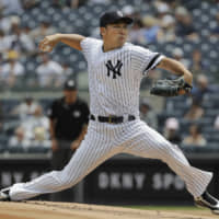 New York starter Masahiro Tanaka pitches against Arizona in the first inning on Wednesday.