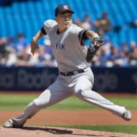 Yankees starting pitcher Masahiro Tanaka throws against the Blue Jays on Sunday in Toronto.