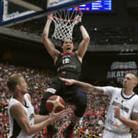 Yuta Watanabe dunks during Japan's win over Germany on Saturday at Saitama Super Arena. Japan upset the Germans 86-83 in a warm-up game ahead of the FIBA World Cup.