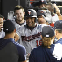 Minnesota's Jonathan Schoop is greeted in the dugout after hitting a second-inning home run against Chicago on Wednesday.