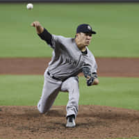 New York starter Masahiro Tanaka pitches against Baltimore in the sixth inning on Monday night.