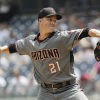 The Arizona Diamondbacks dealt ace Zack Greinke to the Houston Astros on Wednesday for four minor league prospects.
