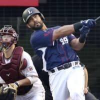 Seibu's Ernesto Mejia hits a three-run double to lift the Lions over the Eagles on Monday in Sendai.