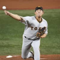 Yomiuri Giants starter Shun Yamaguchi fires a pitch against Yokohama on Friday night. KYODO