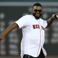 Former Red Sox slugger David Ortiz throws out the ceremonial first pitch before Monday's game against the Yankees at Fenway Park.