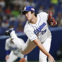 The Dragons' Kodai Umetsu pitches against the Swallows on Wednesday night at Nagoya Dome.