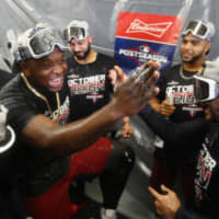 Minnesota third baseman Miguel Sano celebrates with teammates after the Twins clinched the AL Central title against Detroit on Wednesday.