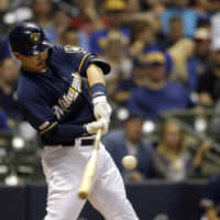 Keston Hiura hits a two-run home run against the Pirates on Saturday in Milwaukee.