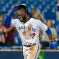 The Blue Jays' Anthony Alford celebrates after hitting a walk-off home run in the 15th inning against the Orioles at Rogers Centre on Monday.