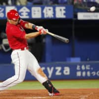 Carp slugger Seiya Suzuki is being closely monitored by MLB scouts.