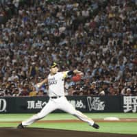Hawks starter Kodai Senga pitches in Saturday's Japan Series opener against the Giants at Yafuoku Dome. Senga pitched seven innings in Fukuoka SoftBank's 7-2 victory over Yomiuri.