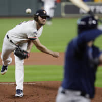 Astros hurler Gerrit Cole fires a pitch in the first inning against the Rays in Game 5 of the ALDS on Thursday in Houston.