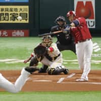 The Eagles' Hideto Asamura clubs a first-inning home run against the Hawks in Game 1 of the first stage of the Pacific League Climax Series on Saturday afternoon at Yafuoku Dome.