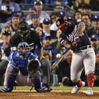 Washington's Howie Kendrick smashes a grand slam against Los Angeles in the 10th inning of Game 5 of their NLDS series on Wednesday night. USA TODAY / VIA REUTERS