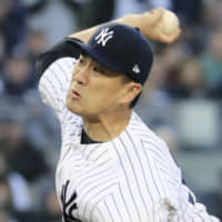 Yankees starter Masahiro Tanaka pitches against the Twins on Saturday in New York.