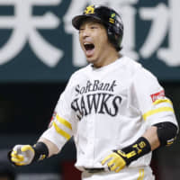 Nobuhiro Matsuda shouts after belting a three-run home run in the seventh inning against the Giants on.