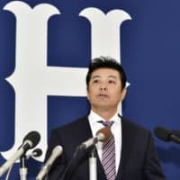 Carp manager Koichi Ogata speaks at a news conference on Tuesday in Hiroshima.