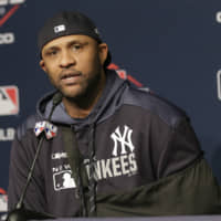 Yankees pitcher CC Sabathia answers questions during a news conference before Game 5 of the ALCS on Friday in New York.