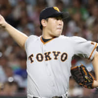 Yomiuri's Shun Yamaguchi pitches against the Hawks in Game 1 of the Japan Series on Saturday in Fukuoka. Yamaguchi was one of several potential candidates for the Sawamura Award, which will not have a recipient in 2019.