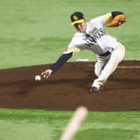 SoftBank starter Rei Takahashi fires a pitch against Yomiuri in Game 2 of the Japan Series on Sunday night in Fukuoka.