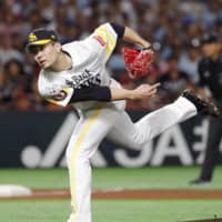 SoftBank starter Kodai Senga fires a pitch against the Yomiuri Giants in Game 1 of the Japan Series on Saturday night in Fukuoka.